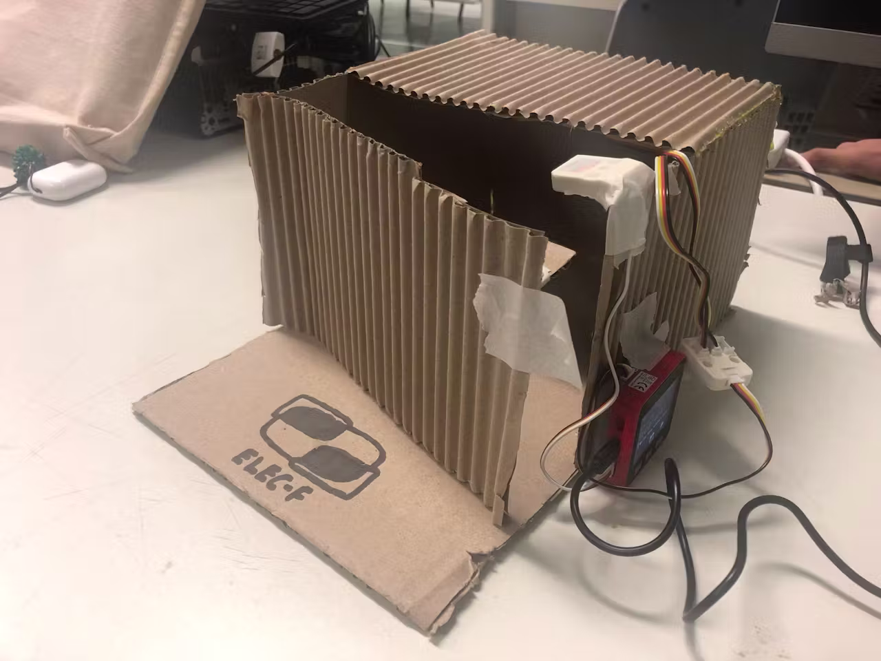 The ELEC-F cardboard freezer prototype with M5Stack and sensors