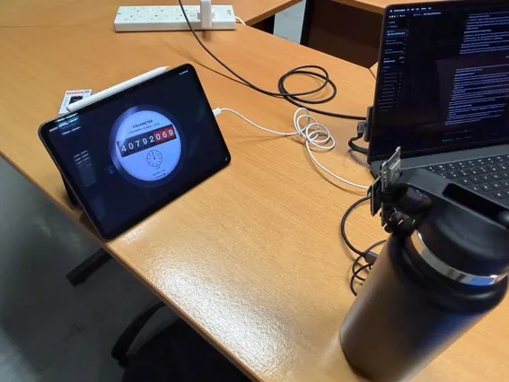 Prototype V0.5, an ESP32-EYE, pointed at a tablet showing the MeterSim display